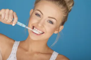 oman brushing her teeth